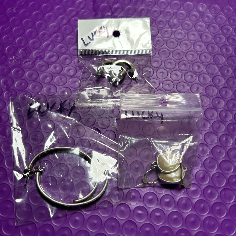 3 pairs Lucky Brand Silver earrings.
